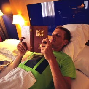 Alessandro De Marchi posting this photo of himself reading a Gideons Hotel Bible with the caption 